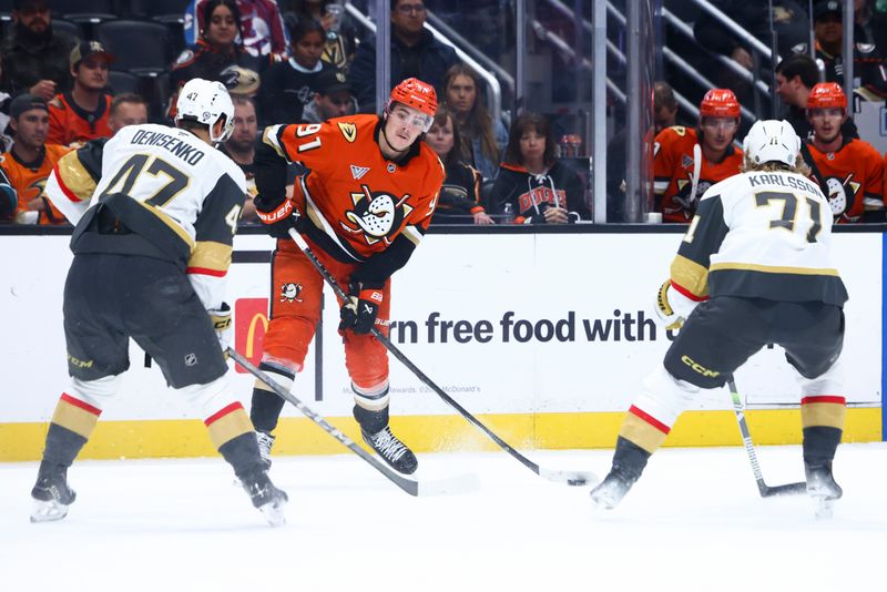 Nov 13, 2024; Anaheim, California, USA; Anaheim Ducks center Leo Carlsson (91) looks to pass the puck during the second period of a hockey game against the Vegas Golden Knights at Honda Center. Mandatory Credit: Jessica Alcheh-Imagn Images