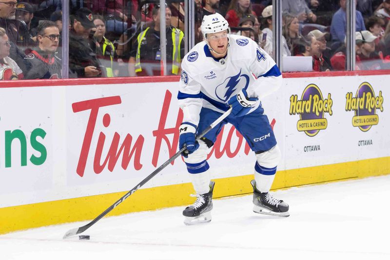 Oct 19, 2024; Ottawa, Ontario, CAN; Tampa Bay Lightning defenseman Darren Raddysh (43) skates with the puck in the first period against the Ottawa Senators at the Canadian Tire Centre. Mandatory Credit: Marc DesRosiers-Imagn Images