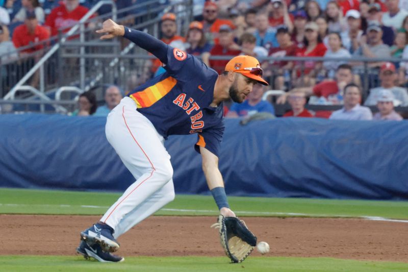 Mar 15, 2024; West Palm Beach, Florida, USA; Houston Astros first baseman David Hensley (11) fields a soft infield dribbler during the fifth inning at The Ballpark of the Palm Beaches. Mandatory Credit: Reinhold Matay-USA TODAY Sports