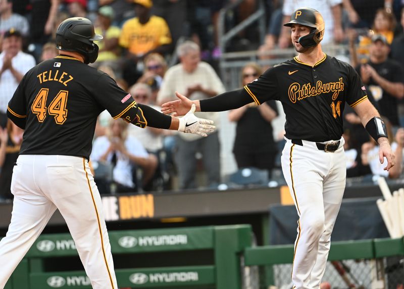 Aug 24, 2024; Pittsburgh, Pennsylvania, USA;   Pittsburgh Pirates first baseman Rowdy Tellez (44) is greeted by catcher Joey Bart (14) after scoring in the second inning against the Cincinnati Reds at PNC Park. Mandatory Credit: Philip G. Pavely-USA TODAY Sports