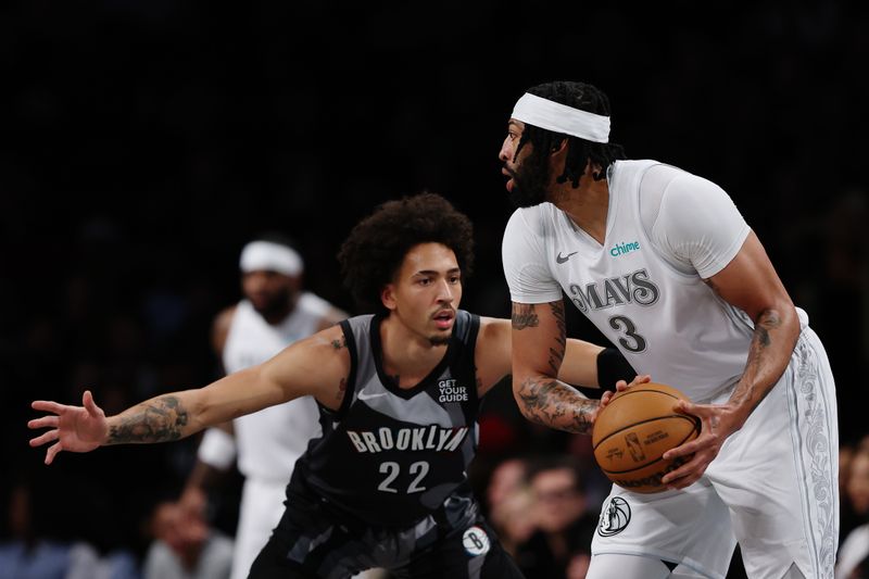 NEW YORK, NEW YORK - MARCH 24: Anthony Davis #3 of the Dallas Mavericks looks to pass as Jalen Wilson #22 of the Brooklyn Nets defends during the first half at Barclays Center on March 24, 2025 in the Brooklyn borough of New York City.  NOTE TO USER: User expressly acknowledges and agrees that, by downloading and or using this photograph, User is consenting to the terms and conditions of the Getty Images License Agreement. (Photo by Sarah Stier/Getty Images)