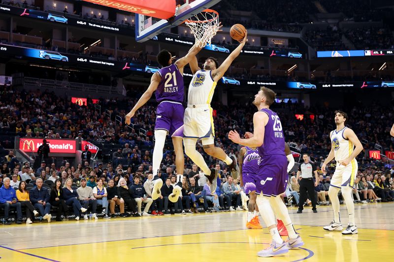 SAN FRANCISCO, CALIFORNIA - APRIL 14: Trayce Jackson-Davis #32 of the Golden State Warriors goes up for a shot on Darius Bazley #21 of the Utah Jazz  in the first half at Chase Center on April 14, 2024 in San Francisco, California. NOTE TO USER: User expressly acknowledges and agrees that, by downloading and or using this photograph, User is consenting to the terms and conditions of the Getty Images License Agreement.  (Photo by Ezra Shaw/Getty Images)