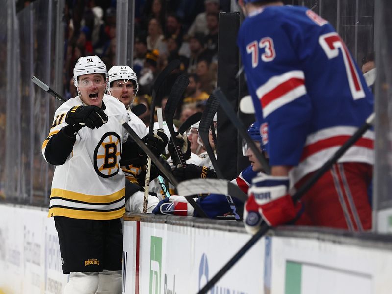 Jan 10, 2026; Boston, Massachusetts, USA; Boston Bruins defenseman Nikita Zadorov (91) has words with New York Rangers center Matt Rempe (73) at the bench during the second period at TD Garden. Mandatory Credit: Winslow Townson-Imagn Images
