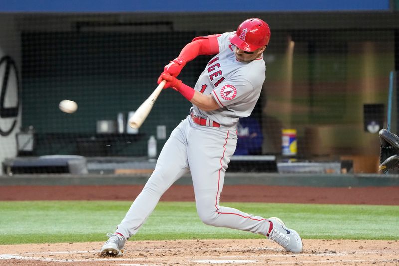 Apr 14, 2022; Arlington, Texas, USA; Los Angeles Angels second baseman Tyler Wade (14) hits and reaches second base on a dropped ball error against the Texas Rangers during the second inning of a baseball game at Globe Life Field. Mandatory Credit: Jim Cowsert-USA TODAY Sports