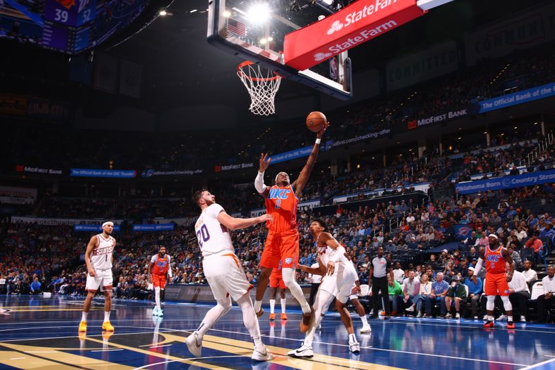 OKLAHOMA CITY, OK - NOVEMBER 15: Shai Gilgeous-Alexander #2 of the Oklahoma City Thunder drives to the basket during the game against the Phoenix Suns during the Emirates NBA Cup game on November 15, 2024 at Paycom Center in Oklahoma City, Oklahoma. NOTE TO USER: User expressly acknowledges and agrees that, by downloading and or using this photograph, User is consenting to the terms and conditions of the Getty Images License Agreement. Mandatory Copyright Notice: Copyright 2024 NBAE (Photo by Zach Beeker/NBAE via Getty Images)