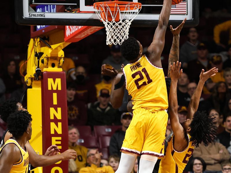 Dec 11, 2022; Minneapolis, Minnesota, USA; Minnesota Golden Gophers forward Pharrel Payne (21) blocks a shot by Mississippi State Bulldogs forward Tyler Stevenson (14) during the first half at Williams Arena. Mandatory Credit: Matt Krohn-USA TODAY Sports