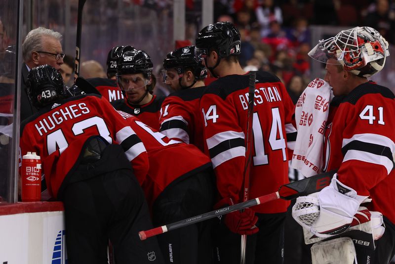 Feb 6, 2024; Newark, New Jersey, USA; New Jersey Devils assistant Ryan McGill speaks with the team during a timeout during the third period of their game against the Colorado Avalanche at Prudential Center. Mandatory Credit: Ed Mulholland-USA TODAY Sports