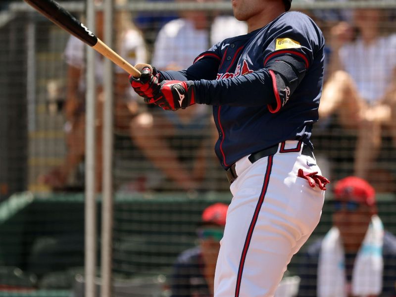 Mar 25, 2024; North Port, Florida, USA;  Atlanta Braves third baseman Austin Riley (27) hits a home run during the third inning against the Minnesota Twins at CoolToday Park. Mandatory Credit: Kim Klement Neitzel-USA TODAY Sports