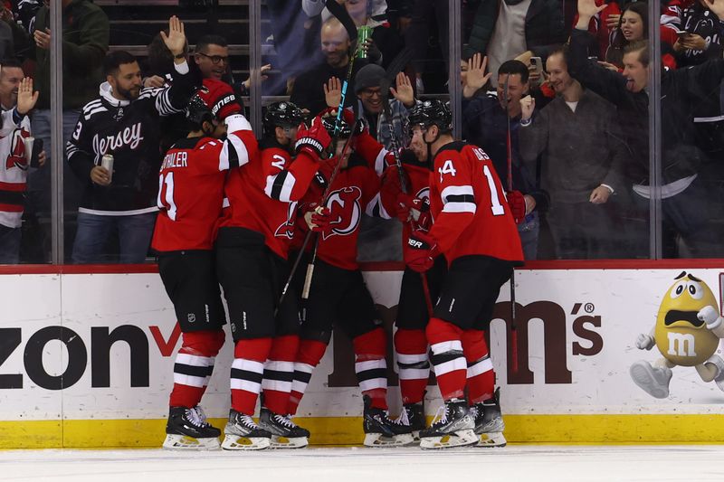 Jan 5, 2024; Newark, New Jersey, USA; New Jersey Devils defenseman Simon Nemec (17) celebrates his goal against the Chicago Blackhawks during the third period at Prudential Center. Mandatory Credit: Ed Mulholland-USA TODAY Sports