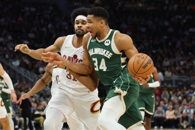 MILWAUKEE, WISCONSIN - JANUARY 24: Giannis Antetokounmpo #34 of the Milwaukee Bucks is defended by Jarrett Allen #31 of the Cleveland Cavaliers during a game at Fiserv Forum on January 24, 2024 in Milwaukee, Wisconsin. NOTE TO USER: User expressly acknowledges and agrees that, by downloading and or using this photograph, User is consenting to the terms and conditions of the Getty Images License Agreement. (Photo by Stacy Revere/Getty Images)