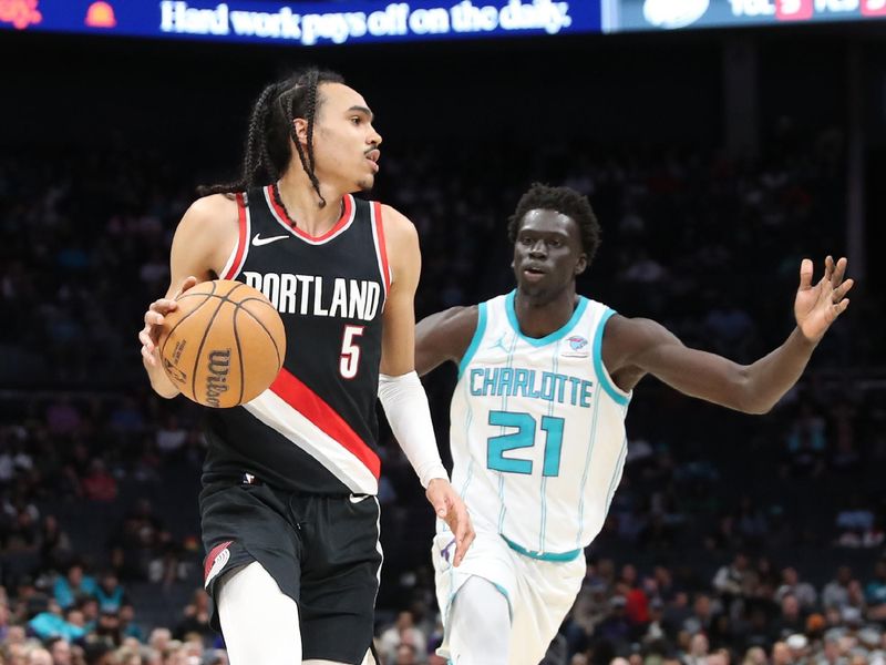 CHARLOTTE, NC - APRIL 3:  Dalano Banton #5 of the Portland Trail Blazers handles the ball during the game against the Charlotte Hornets on April 3, 2024 at Spectrum Center in Charlotte, North Carolina. NOTE TO USER: User expressly acknowledges and agrees that, by downloading and or using this photograph, User is consenting to the terms and conditions of the Getty Images License Agreement.  Mandatory Copyright Notice:  Copyright 2024 NBAE (Photo by Brock Williams-Smith/NBAE via Getty Images)