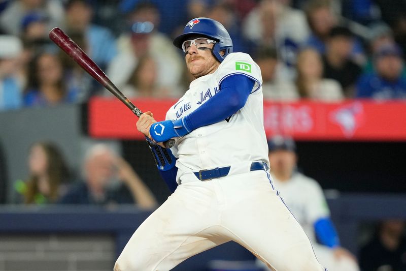 Apr 27, 2024; Toronto, Ontario, CAN; Toronto Blue Jays catcher Danny Jansen (9) gets out of the way of a Los Angeles Dodgers pitch during the seventh inning at Rogers Centre. Mandatory Credit: John E. Sokolowski-USA TODAY Sports