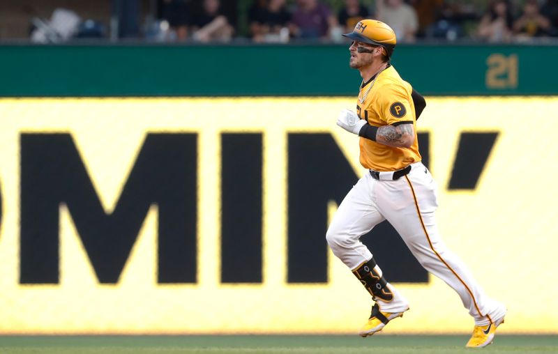 Aug 16, 2024; Pittsburgh, Pennsylvania, USA;  Pittsburgh Pirates catcher Yasmani Grandal (6) circles the bases on a solo home run against the Seattle Mariners during the fifth inning at PNC Park. Mandatory Credit: Charles LeClaire-USA TODAY Sports