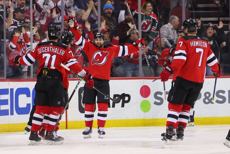 Feb 23, 2023; Newark, New Jersey, USA; The New Jersey Devils celebrate a goal by New Jersey Devils center Dawson Mercer (91) against the Los Angeles Kings during the third period at Prudential Center. Mandatory Credit: Ed Mulholland-USA TODAY Sports