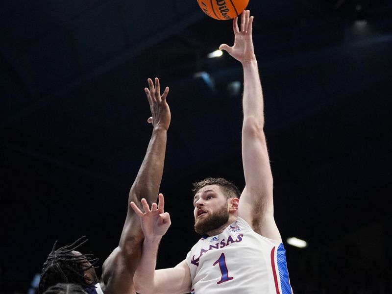 Jan 6, 2024; Lawrence, Kansas, USA; Kansas Jayhawks center Hunter Dickinson (1) shoots over TCU Horned Frogs center Ernest Udeh Jr. (8) and forward Emanuel Miller (2) during the second half at Allen Fieldhouse. Mandatory Credit: Jay Biggerstaff-USA TODAY Sports