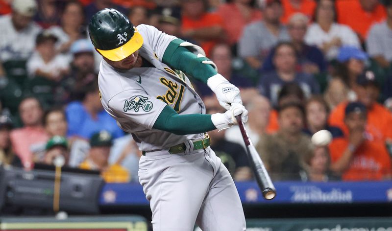 Sep 11, 2023; Houston, Texas, USA; Oakland Athletics right fielder Brent Rooker (25) hits a home run during the second inning against the Houston Astros at Minute Maid Park. Mandatory Credit: Troy Taormina-USA TODAY Sports