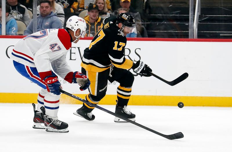 Feb 22, 2024; Pittsburgh, Pennsylvania, USA; Pittsburgh Penguins right wing Bryan Rust (17) moves the puck as Montreal Canadiens defenseman Jayden Struble (47) chases during the first period at PPG Paints Arena. Mandatory Credit: Charles LeClaire-USA TODAY Sports