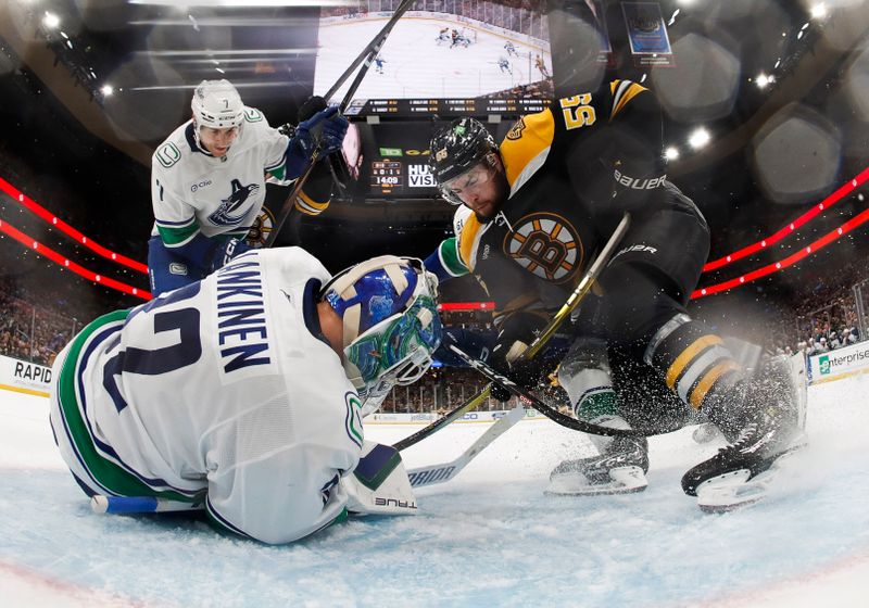 Nov 26, 2024; Boston, Massachusetts, USA; Boston Bruins right wing Justin Brazeau (55) can’t get to a loose puck before Vancouver Canucks goaltender Kevin Lankinen (32) covers it up during the third period at TD Garden. Mandatory Credit: Winslow Townson-Imagn Images