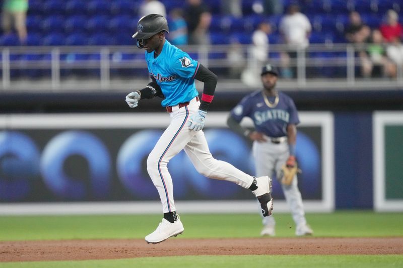 Jun 23, 2024; Miami, Florida, USA;  Miami Marlins center fielder Nick Gordon (1) rounds the bases after hitting a three-run home run against the Seattle Mariners in the first inning at loanDepot Park. Mandatory Credit: Jim Rassol-USA TODAY Sports