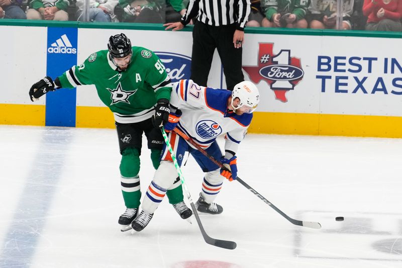 May 31, 2024; Dallas, Texas, USA; Edmonton Oilers defenseman Brett Kulak (27) skates with the puck as Dallas Stars center Tyler Seguin (91) defends during the third period between the Dallas Stars and the Edmonton Oilers in game five of the Western Conference Final of the 2024 Stanley Cup Playoffs at American Airlines Center. Mandatory Credit: Chris Jones-USA TODAY Sports