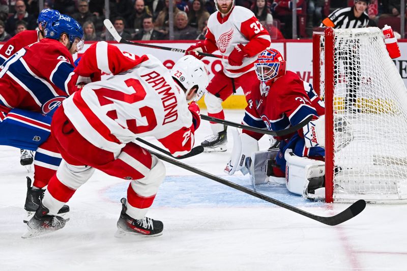 Dec 2, 2023; Montreal, Quebec, CAN; Montreal Canadiens goalie Jake Allen (34) makes a save against Detroit Red Wings left wing Lucas Raymond (23) during the second period at Bell Centre. Mandatory Credit: David Kirouac-USA TODAY Sports