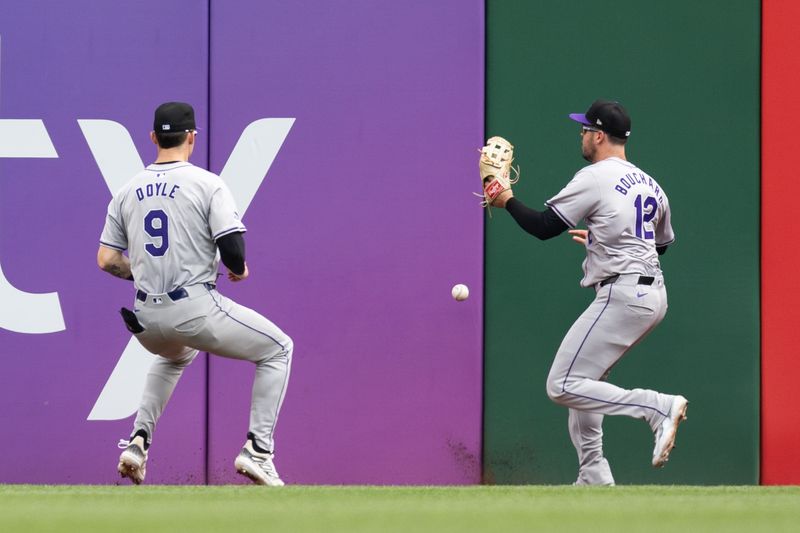 May 5, 2024; Pittsburgh, Pennsylvania, USA; Colorado Rockies center fielder Brenton Doyle (9) and right fielder Sean Bouchard (12) chase after the ball on a triple by the Pittsburgh Pirates during the seventh inning at PNC Park. Mandatory Credit: Scott Galvin-USA TODAY Sports