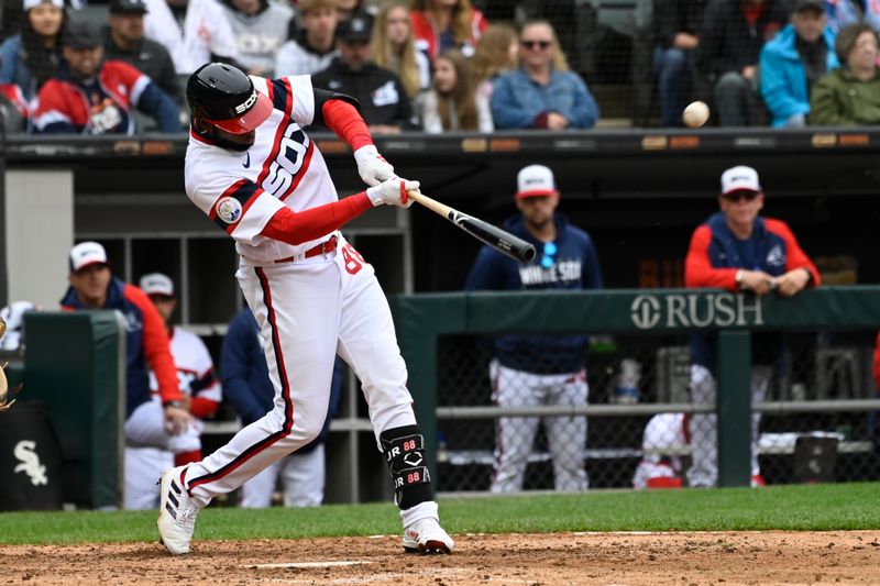 Jun 11, 2023; Chicago, Illinois, USA;  Chicago White Sox center fielder Luis Robert Jr. (88) hits a two-run home run against the Miami Marlins during the seventh inning at Guaranteed Rate Field. Mandatory Credit: Matt Marton-USA TODAY Sports