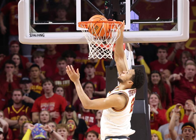 Mar 4, 2025; Ames, Iowa, USA; Iowa State Cyclones forward Joshua Jefferson (2) scores against the Brigham Young Cougars during the second half at James H. Hilton Coliseum. Mandatory Credit: Reese Strickland-Imagn Images