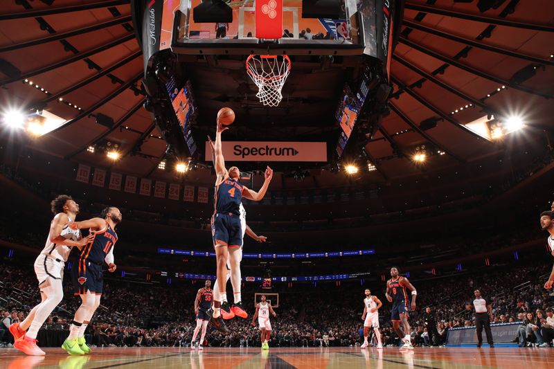 NEW YORK, NY - NOVEMBER 15: Pacome Dadiet #4 of the New York Knicks rebounds the ball during the game against the Brooklyn Nets during the Emirates NBA Cup game on November 15, 2024 at Madison Square Garden in New York City, New York.  NOTE TO USER: User expressly acknowledges and agrees that, by downloading and or using this photograph, User is consenting to the terms and conditions of the Getty Images License Agreement. Mandatory Copyright Notice: Copyright 2024 NBAE  (Photo by Nathaniel S. Butler/NBAE via Getty Images)