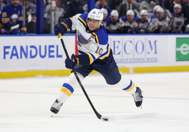 Nov 14, 2024; Buffalo, New York, USA;  St. Louis Blues center Brayden Schenn (10) takes a shot on goal during the first period against the Buffalo Sabres at KeyBank Center. Mandatory Credit: Timothy T. Ludwig-Imagn Images