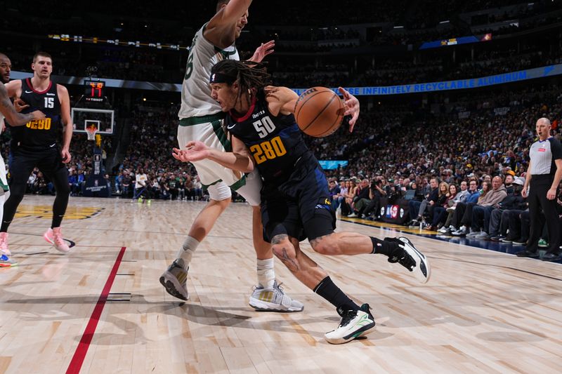 DENVER, CO - MARCH 7: Aaron Gordon #50 of the Denver Nuggets drives to the basket during the game against the Boston Celtics on March 7, 2024 at the Ball Arena in Denver, Colorado. NOTE TO USER: User expressly acknowledges and agrees that, by downloading and/or using this Photograph, user is consenting to the terms and conditions of the Getty Images License Agreement. Mandatory Copyright Notice: Copyright 2024 NBAE (Photo by Garrett Ellwood/NBAE via Getty Images)