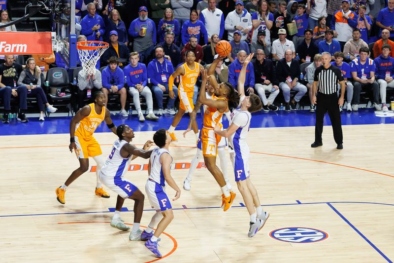 Jan 7, 2025; Gainesville, Florida, USA; Tennessee Volunteers guard Chaz Lanier (2) shoots over Florida Gators forward Alex Condon (21) during the second half at Exactech Arena at the Stephen C. O'Connell Center. Mandatory Credit: Matt Pendleton-Imagn Images