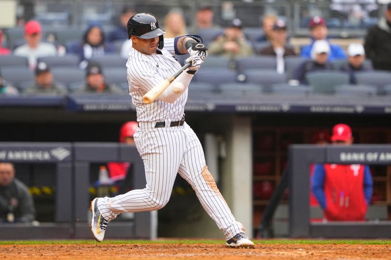 Apr 5, 2023; Bronx, New York, USA;  New York Yankees designated hitter Gleybor Torres (25) hits an RBI single against the Philadelphia Phillies during the sixth inning at Yankee Stadium. Mandatory Credit: Gregory Fisher-USA TODAY Sports