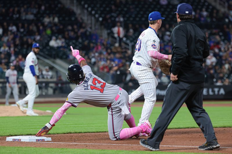 May 12, 2024; New York City, New York, USA; Atlanta Braves right fielder Ronald Acuna Jr. (13) reacts being called out by umpire DJ Reyburn (17) on a pick off play by New York Mets starting pitcher Luis Severino (40) and first baseman Pete Alonso (20) during the fifth inning at Citi Field. Mandatory Credit: Vincent Carchietta-USA TODAY Sports