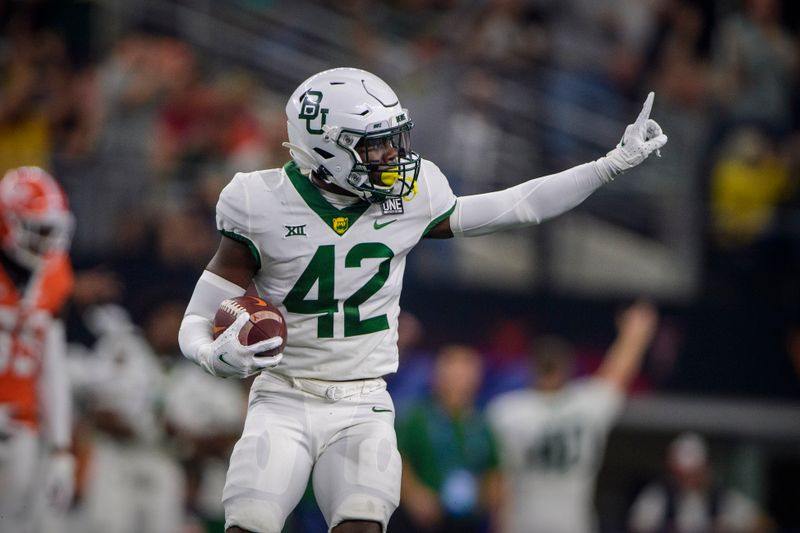 Dec 4, 2021; Arlington, TX, USA; Baylor Bears safety Jairon McVea (42) celebrates intercepting a pass against the Oklahoma State Cowboys during the second half in the Big 12 Conference championship game at AT&T Stadium. Mandatory Credit: Jerome Miron-USA TODAY Sports