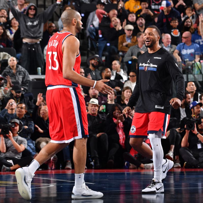 INGLEWOOD, CA - DECEMBER 3: Nicolas Batum #33 and Norman Powell #24 of the LA Clippers high five during the game against the Portland Trail Blazers on December 3, 2024 at Intuit Dome in Los Angeles, California. NOTE TO USER: User expressly acknowledges and agrees that, by downloading and/or using this Photograph, user is consenting to the terms and conditions of the Getty Images License Agreement. Mandatory Copyright Notice: Copyright 2024 NBAE (Photo by Juan Ocampo/NBAE via Getty Images)