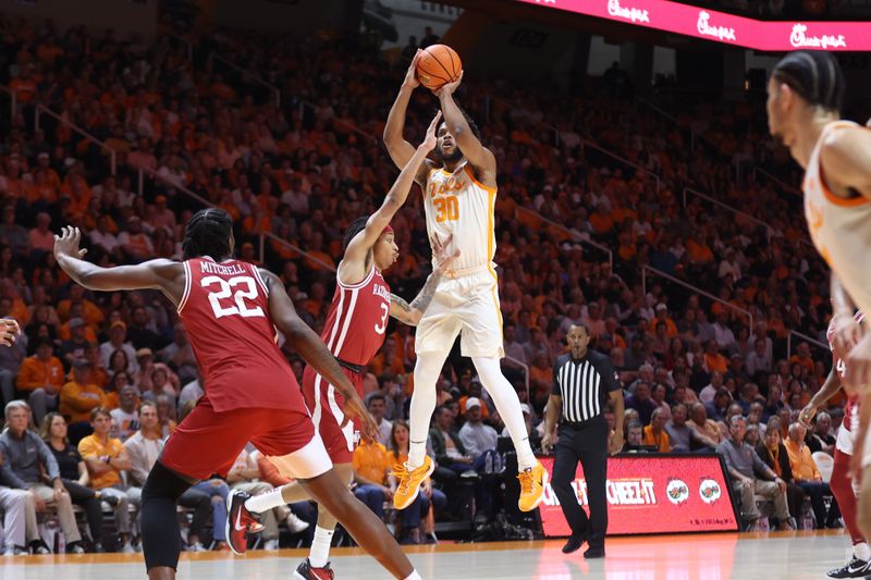 Feb 28, 2023; Knoxville, Tennessee, USA; Tennessee Volunteers guard Josiah-Jordan James (30) shoots the ball against the Arkansas Razorbacks during the first half at Thompson-Boling Arena. Mandatory Credit: Randy Sartin-USA TODAY Sports