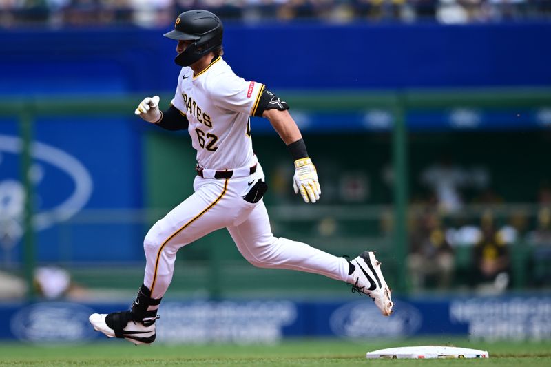 May 4, 2025; Pittsburgh, Pennsylvania, USA; Pittsburgh Pirates first basemen Matthew Gorski (62) runs after hitting a triple during the seventh inning against the Pittsburgh Pirates at PNC Park. Mandatory Credit: David Dermer-Imagn Images