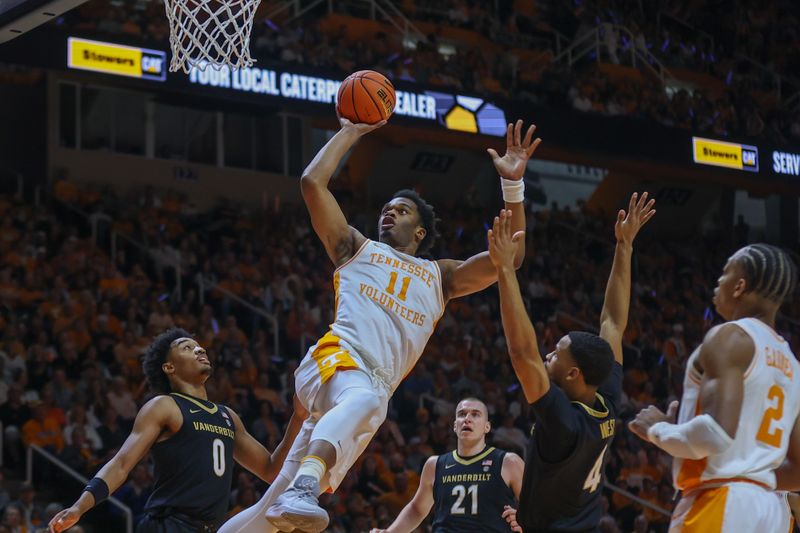 Feb 17, 2024; Knoxville, Tennessee, USA; Tennessee Volunteers forward Tobe Awaka (11) shoots the ball against the Vanderbilt Commodores during the first half at Thompson-Boling Arena at Food City Center. Mandatory Credit: Randy Sartin-USA TODAY Sports