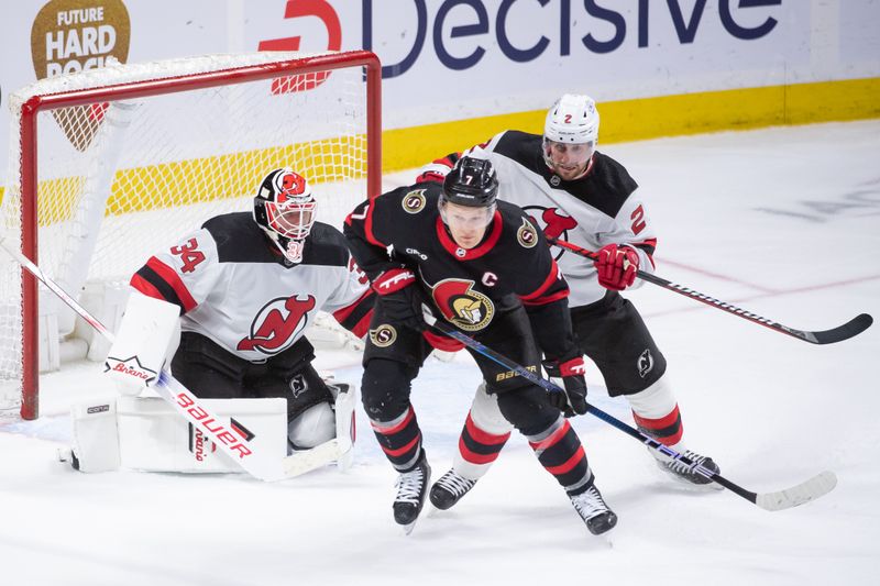 Apr 6, 2024; Ottawa, Ontario, CAN; Ottawa Senators left wing Brady Tkachuk (7) jockeys for position in front of New Jersey Devils goalie Jake Allen (34) and defenseman Brendan Smith (2) in the third period at the Canadian Tire Centre. Mandatory Credit: Marc DesRosiers-USA TODAY Sports