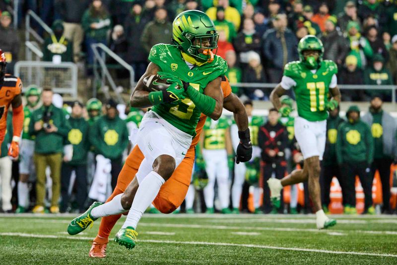 Nov 24, 2023; Eugene, Oregon, USA; Oregon Ducks wide receiver Traeshon Holden (5) catches a pass during the second half against the Oregon State Beavers at Autzen Stadium. Mandatory Credit: Troy Wayrynen-USA TODAY Sports