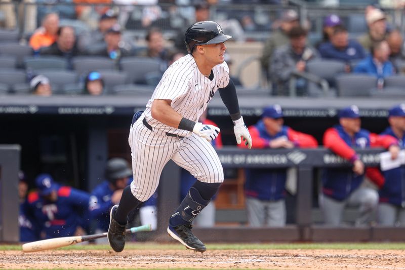 May 22, 2025; Bronx, New York, USA; New York Yankees shortstop Anthony Volpe (11) singles during the sixth inning against the Texas Rangers at Yankee Stadium. Mandatory Credit: Vincent Carchietta-Imagn Images