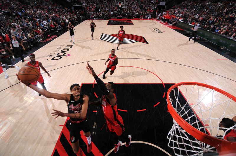 PORTLAND, OR - APRIL 12: Rayan Rupert #72 of the Portland Trail Blazers drives to the basket during the game against the Houston Rockets on April 12, 2024 at the Moda Center Arena in Portland, Oregon. NOTE TO USER: User expressly acknowledges and agrees that, by downloading and or using this photograph, user is consenting to the terms and conditions of the Getty Images License Agreement. Mandatory Copyright Notice: Copyright 2024 NBAE (Photo by Cameron Browne/NBAE via Getty Images)