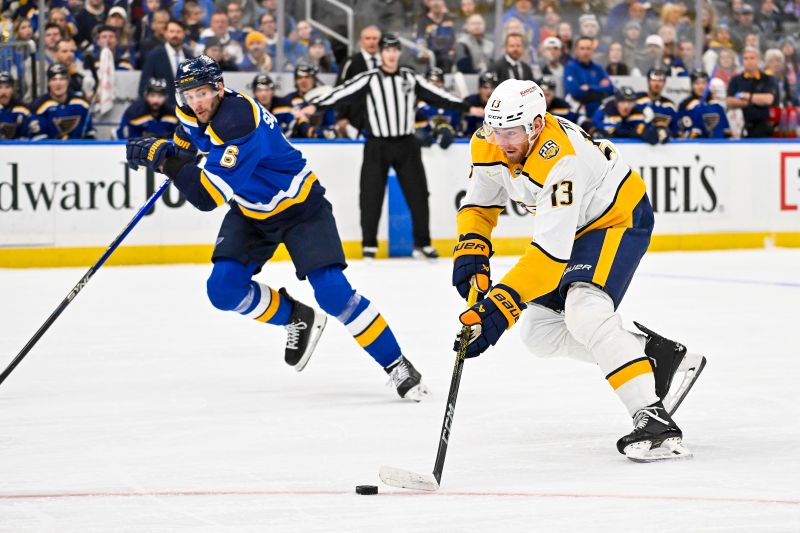 Nov 24, 2023; St. Louis, Missouri, USA;  Nashville Predators center Yakov Trenin (13) controls the puck against the St. Louis Blues during the first period at Enterprise Center. Mandatory Credit: Jeff Curry-USA TODAY Sports