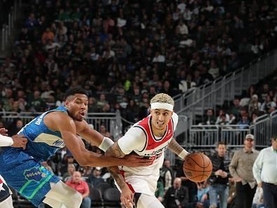 MILWAUKEE, WI - NOVEMBER 24: Kyle Kuzma #33 of the Washington Wizards drives to the basket during the game against the Milwaukee Bucks during the In-Season Tournament on November 24, 2023 at the Fiserv Forum Center in Milwaukee, Wisconsin. NOTE TO USER: User expressly acknowledges and agrees that, by downloading and or using this Photograph, user is consenting to the terms and conditions of the Getty Images License Agreement. Mandatory Copyright Notice: Copyright 2023 NBAE (Photo by Gary Dineen/NBAE via Getty Images).