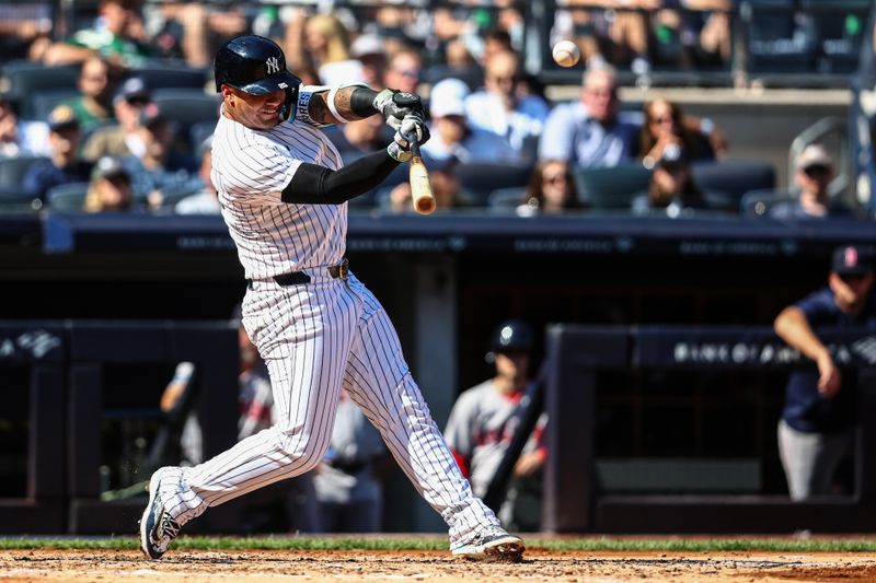 Sep 15, 2024; Bronx, New York, USA;  New York Yankees second baseman Gleyber Torres (25) hits a solo home run in the third inning against the Boston Red Sox at Yankee Stadium. Mandatory Credit: Wendell Cruz-Imagn Images