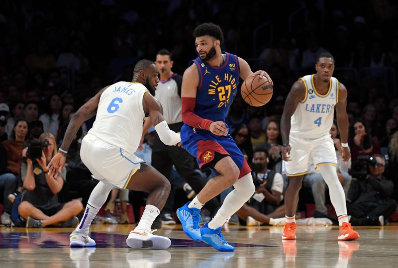 LOS ANGELES, CA - OCTOBER 30: Jamal Murray #27 of the Denver Nuggets spins around LeBron James #6 of the Los Angeles Lakers during the second half at Crypto.com Arena on October 30, 2022 in Los Angeles, California. NOTE TO USER: User expressly acknowledges and agrees that, by downloading and or using this photograph, User is consenting to the terms and conditions of the Getty Images License Agreement. (Photo by Kevork Djansezian/Getty Images)