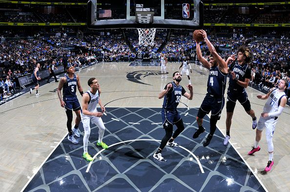 ORLANDO, FL - NOVEMBER 6:Jalen Suggs #4 of the Orlando Magic grabs a rebound during the game against the Dallas Mavericks on November 6, 2023 at Amway Center in Orlando, Florida. NOTE TO USER: User expressly acknowledges and agrees that, by downloading and or using this photograph, User is consenting to the terms and conditions of the Getty Images License Agreement. Mandatory Copyright Notice: Copyright 2023 NBAE (Photo by Fernando Medina/NBAE via Getty Images)