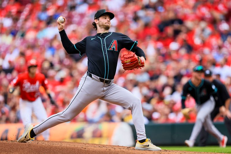 Jun 7, 2025; Cincinnati, Ohio, USA; Arizona Diamondbacks starting pitcher Ryne Nelson (19) pitches against the Cincinnati Reds in the first inning at Great American Ball Park. Mandatory Credit: Katie Stratman-Imagn Images