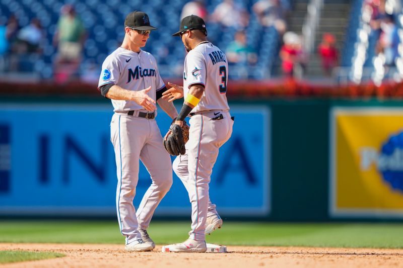 Sep 3, 2023; Washington, District of Columbia, USA;  Miami Marlins shortstop Joey Wendle (18) and second baseman Luis Arraez (3) celebrate the victory after the game against the Washington Nationals at Nationals Park. Mandatory Credit: Gregory Fisher-USA TODAY Sports